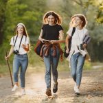 adventure-travel-tourism-hike-people-concept-three-girls-forest